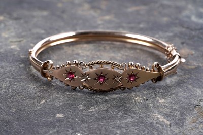 Lot 47 - An Edwardian Etruscan Revival diamond and paste bangle