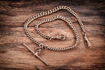 Lot 297 - An early 20th Century 9ct rose gold double "Albert" curb-link watch chain