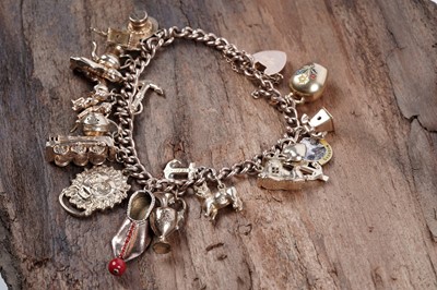 Lot 331 - A 9ct yellow gold charm bracelet