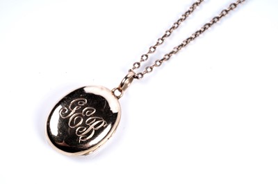 Lot 61 - An early 20th Century locket on a 9ct rose gold chain