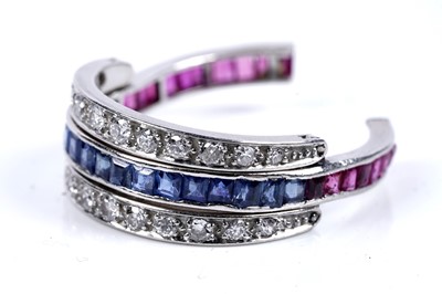 Lot 63 - A sapphire, ruby and diamond articulated eternity ring