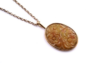 Lot 691 - A Chinese carved jade panel pendant