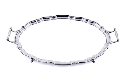 Lot 141 - A George V silver two-handled tray of shaped oval outline