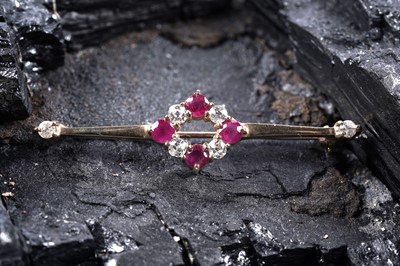 Lot 550 - An Edwardian style ruby and diamond bar brooch
