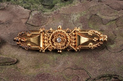 Lot 5 - A Victorian Etruscan Revival diamond set 15ct gold bar brooch