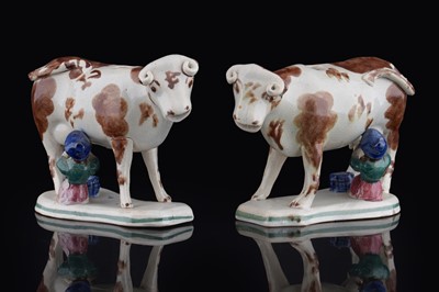 Lot 374 - A pair of 19th Century cow creamers