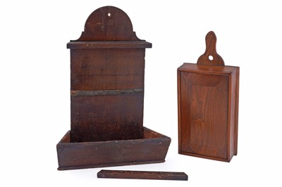 Lot 197 - A Georgian pitch pine spoon rack; and an elm candle box