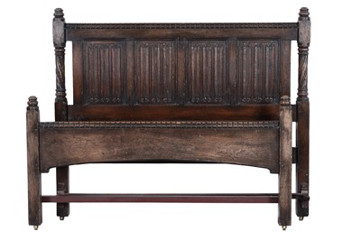 Lot 82 - An early 20th Century carved oak bed