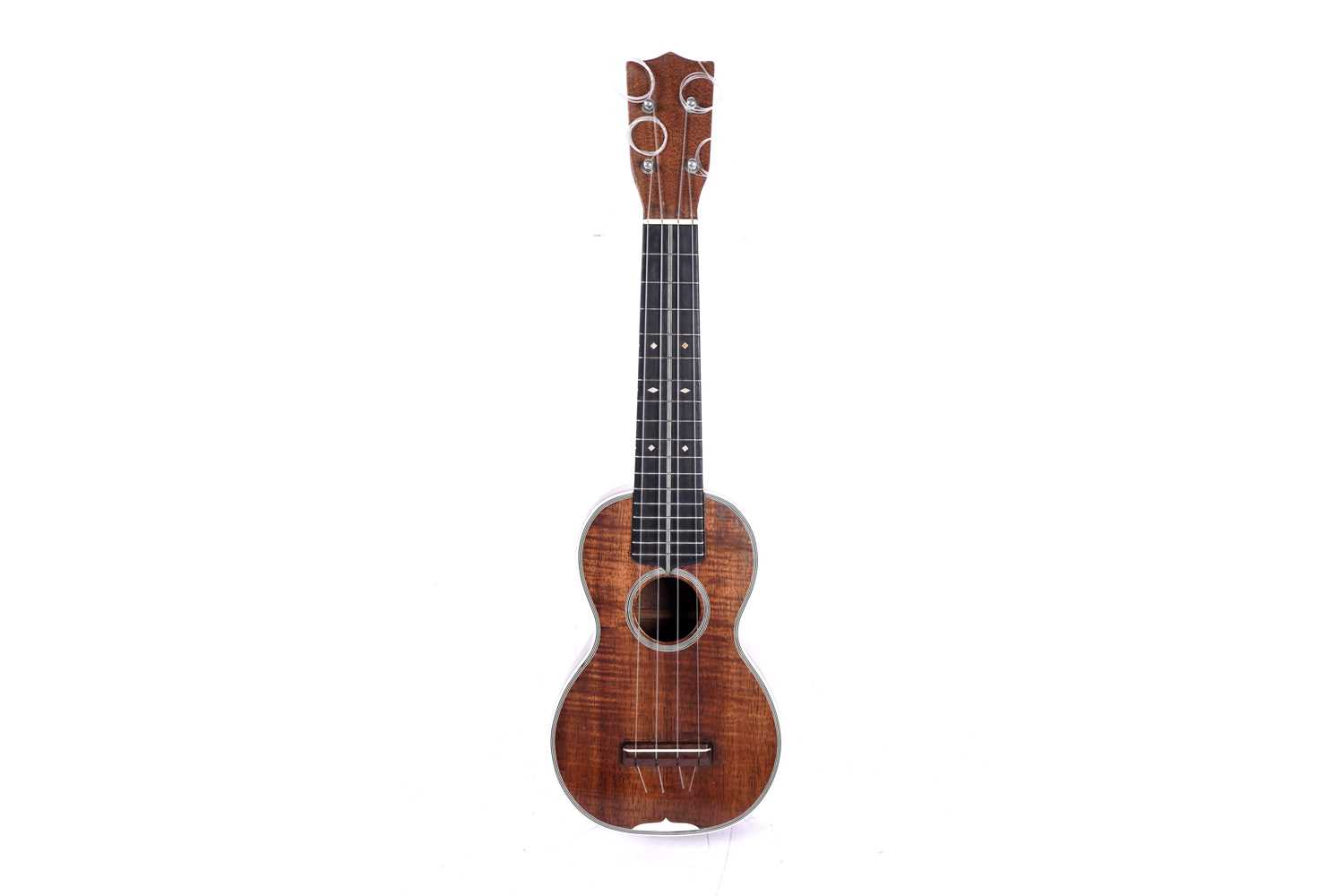 Lot 46 - A Martin style 3K soprano ukulele; and two cases, one original