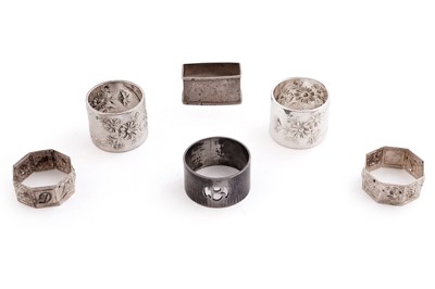 Lot 512 - A large collection of silver napkin rings; and a small selection of plated napkin rings