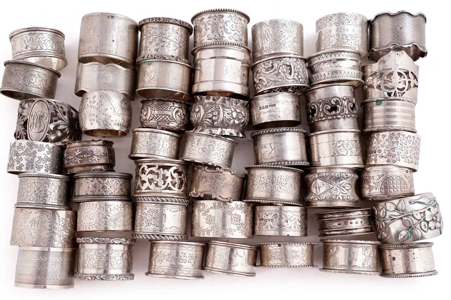 Lot 512 - Fifty silver napkin rings