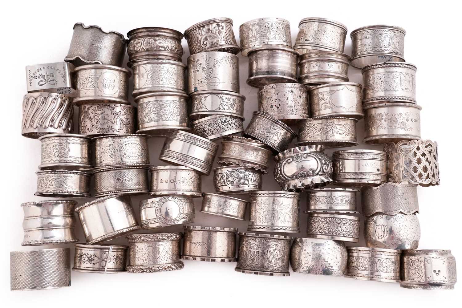 Lot 512 - Fifty silver napkin rings