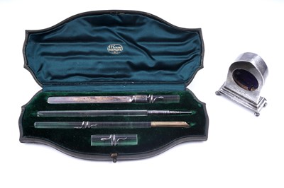 Lot 344 - A Victorian mounted clear glass writing set; and an Edwardian silver mounted watch stand