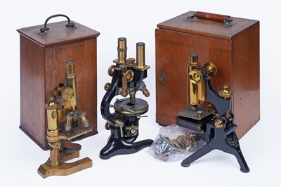 Lot 463 - Two early 20th Century microscopes in fitted cases; and another unboxed microscope