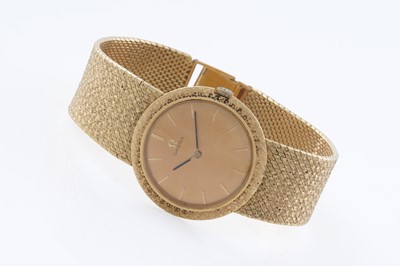 Lot 613 - Omega: an 18ct yellow gold cased manual wind wristwatch