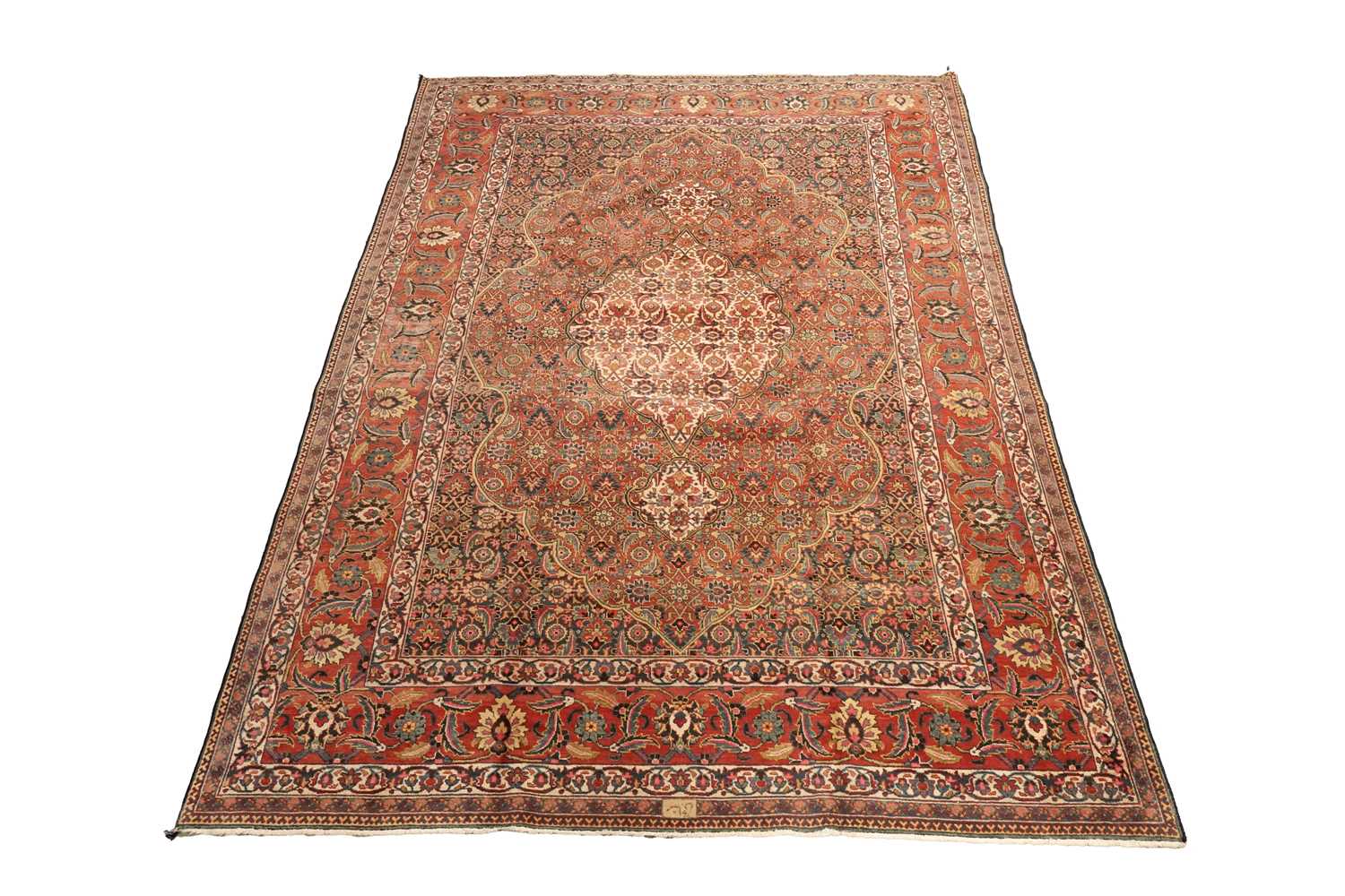 Lot 519 - A hand knotted Persian Tabriz carpet