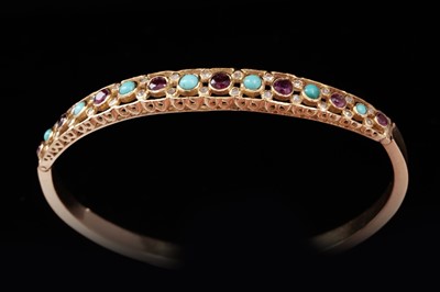 Lot 695 - A Victorian-style ruby and turquoise bangle