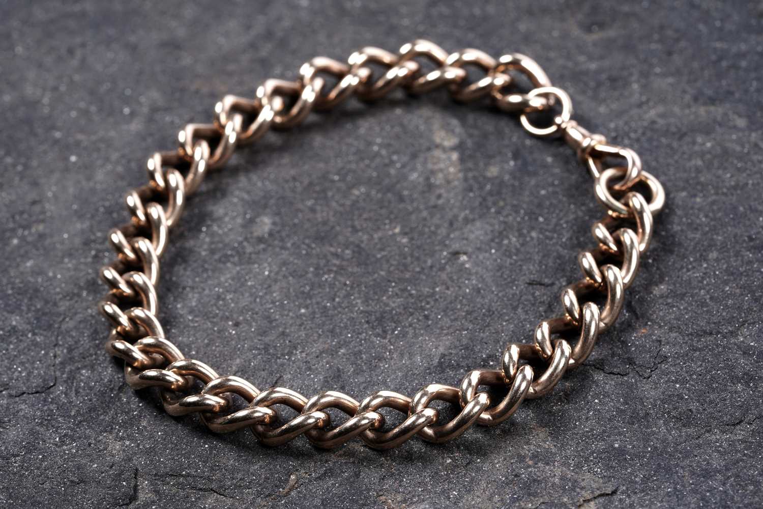 Lot 599 - A 9ct gold curb-link watch chain
