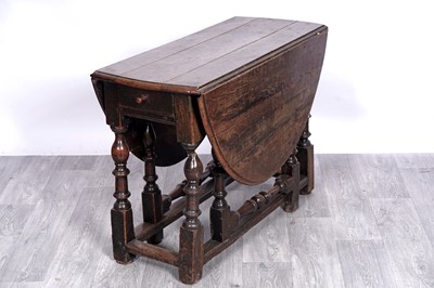 Lot 11 - An 18th Century oak gateleg table