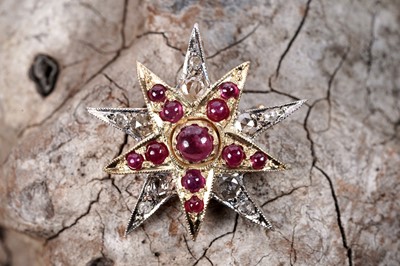 Lot 235 - A Victorian style ruby and diamond star pattern brooch