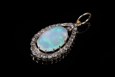 Lot 132 - An Edwardian style opal and diamond pendant