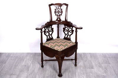 Lot 52 - A Georgian mahogany high-backed corner chair commode
