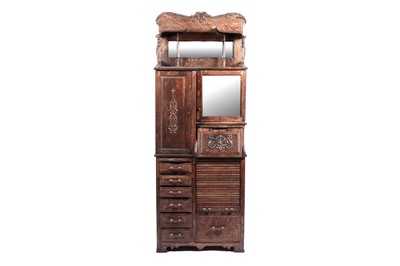 Lot 627 - An early 20th Century American oak dentist’s cabinet by ‘The Harvard Co. Canton Ohio’