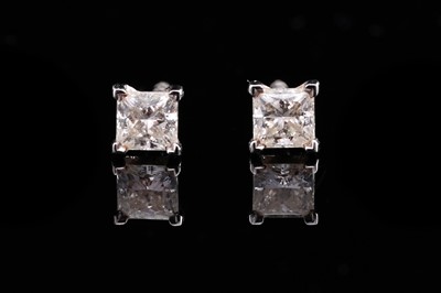 Lot 700 - Tiffany & Co: a pair of princess-cut diamond stud earrings