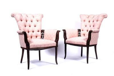 Lot 628 - An elegant pair of continental carved mahogany armchairs