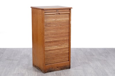Lot 67 - An early 20th Century oak tambour fronted filing cabinet