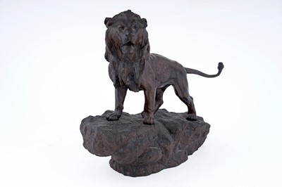Lot 208 - A bronzed resin figure of a lion
