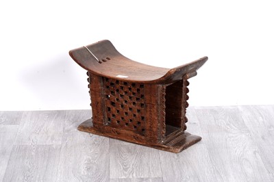 Lot 52 - An African carved hardwood Ashanti stool