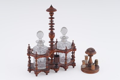 Lot 199 - A Victorian turned mahogany decanter stand; and a turned treen sewing compendium