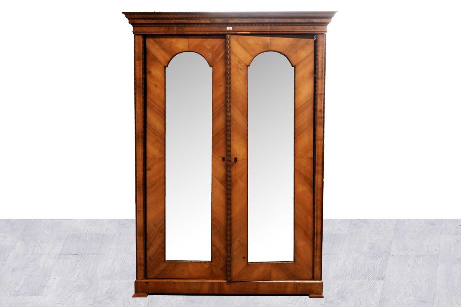 Lot 12 - A mid-19th Century Biedermeier walnut armoire