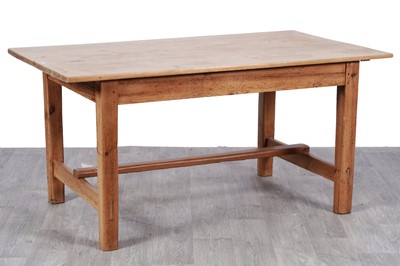 Lot 9 - A vintage farmhouse style pine dining table