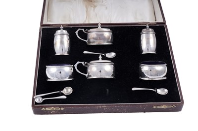 Lot 145 - A George V cased six-piece silver condiment set; and spoons