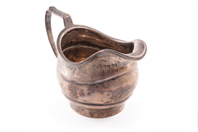 Lot 449 - A Georgian silver cream jug