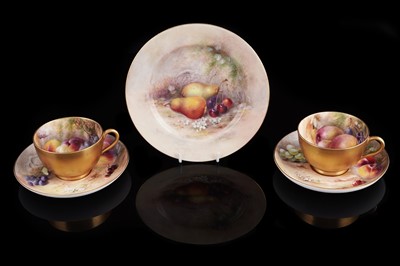 Lot 402 - Two Royal Worcester fruit-painted teacups and saucers; and a plate