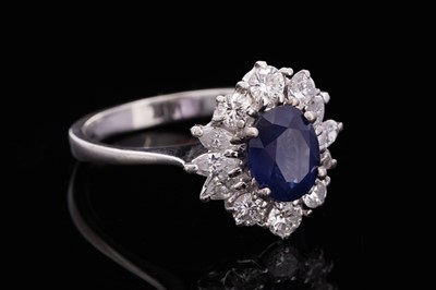 Lot 706 - A sapphire and diamond cluster ring