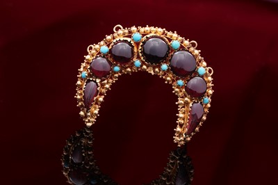 Lot 709 - A 19th Century garnet and turquoise crescent brooch