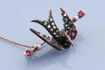 Lot 714 - A Victorian ruby and diamond bird pattern brooch