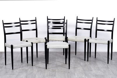 Lot 86 - E Gomme for G-Plan: a set of six ebonised dining chairs