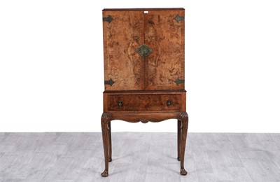 Lot 6 - In the manner of Epstein: An early 20th Century walnut banded drinks cabinet