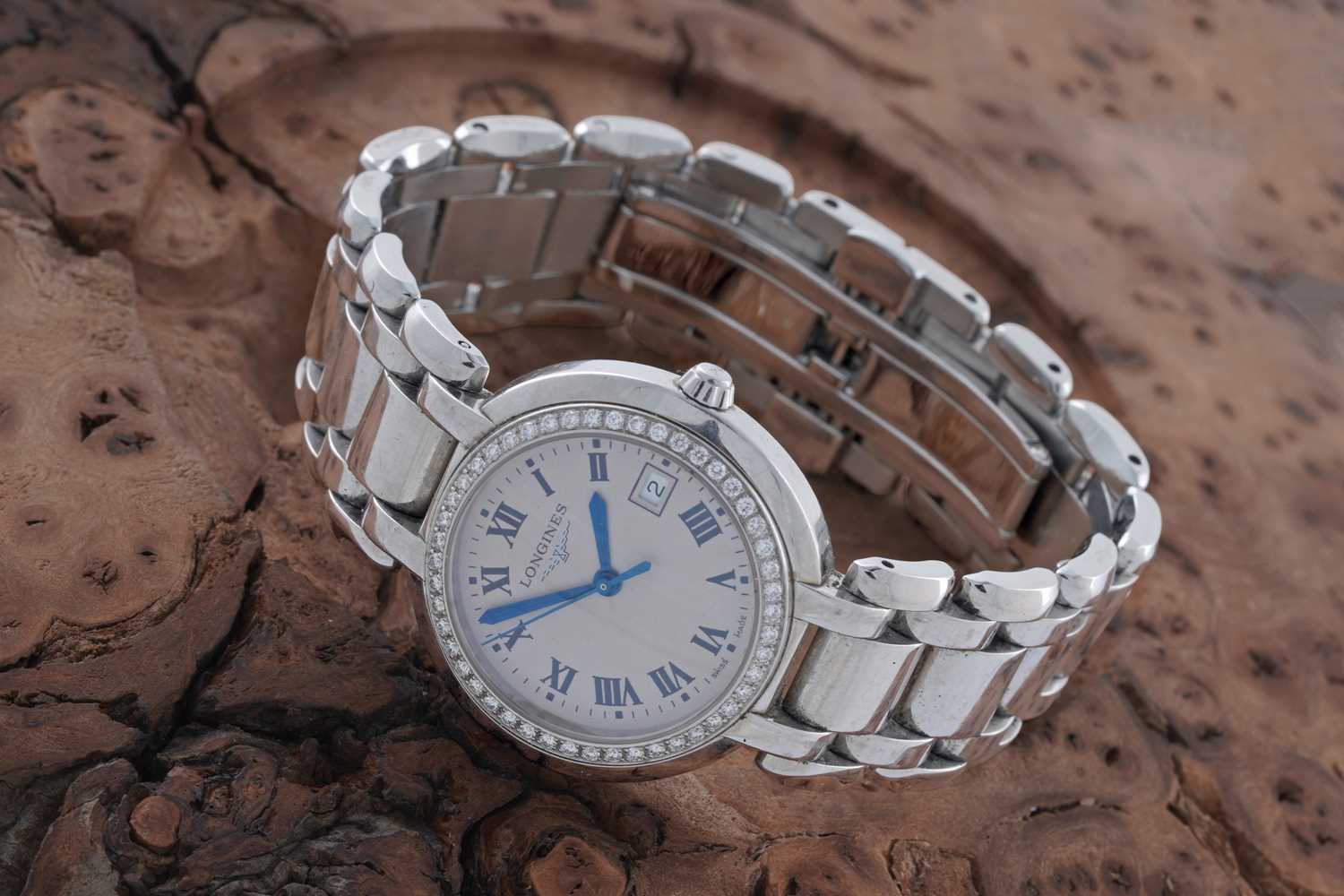 Lot 415 - Longines PrimaLuna: a stainless steel cased lady's wristwatch