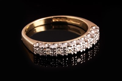 Lot 293 - A 1970s diamond half hoop eternity ring