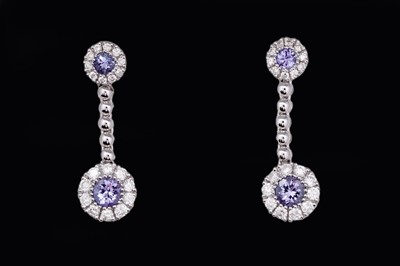 Lot 728 - A pair of tanzanite and diamond earrings