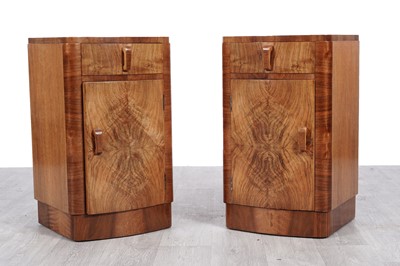 Lot 103 - A pair of Art Deco walnut bowfront bedside cabinets