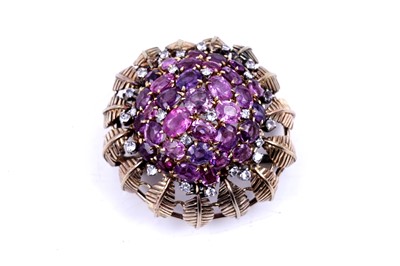 Lot 652 - A modern pink-sapphire, white-stone and yellow gold flower pattern brooch