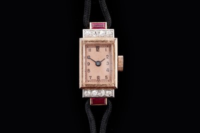 Lot 653 - An Art Deco ruby and diamond set cocktail watch