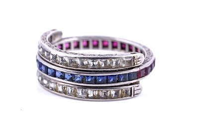 Lot 33 - A sapphire, ruby and white sapphire day-to-night ring